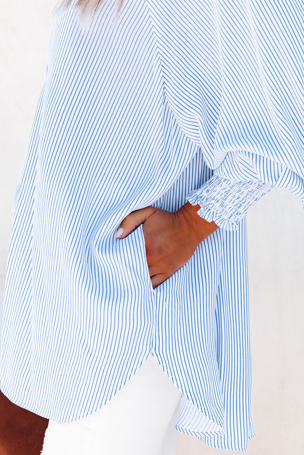Mid-length smocked shirt with striped lapel and oversized drawdown sleeves
